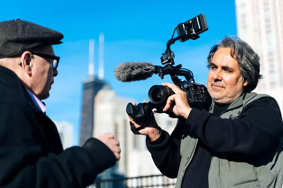 Ray Santisteban (right) conducts an interview for his film The First Rainbow Coalition. - PBS