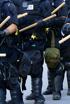 Police in riot gear stand at the ready during the George Floyd protests in San Antonio on Saturday, May 30.