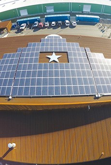 Solar panels lined up on the roof of Alamo Brewing Company.