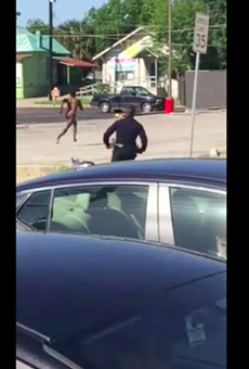 A naked man runs from police near San Pedro Avenue.