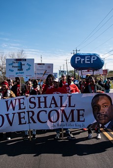 Marchers carry a banner during the 2020 Martin Luther King Day March in San Antonio.