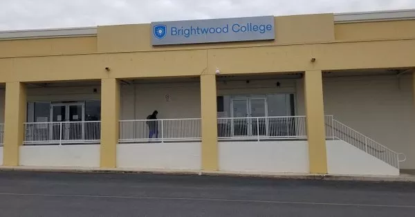 A person leaves one of San Antonio's two shuttered Brightwood campuses. - TWITTER / KSATNEWS
