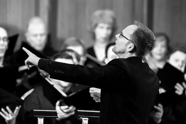 Craig Hella Johnson leading the choir - COURTESY