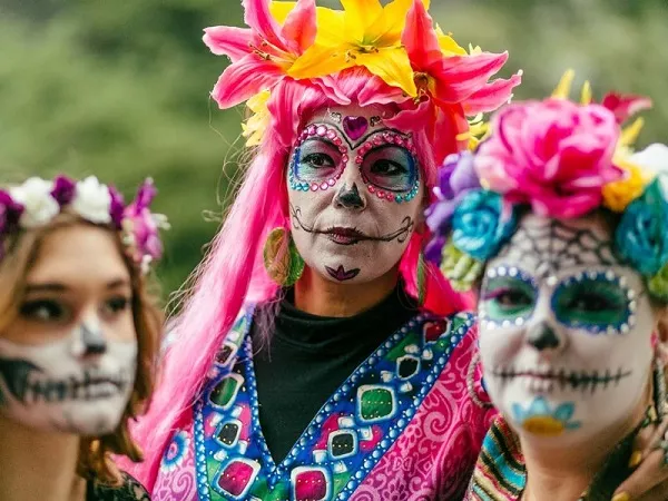 Decked out revelers at Muertos Fest. - PHOTO CREDIT: JOSH HUSKIN