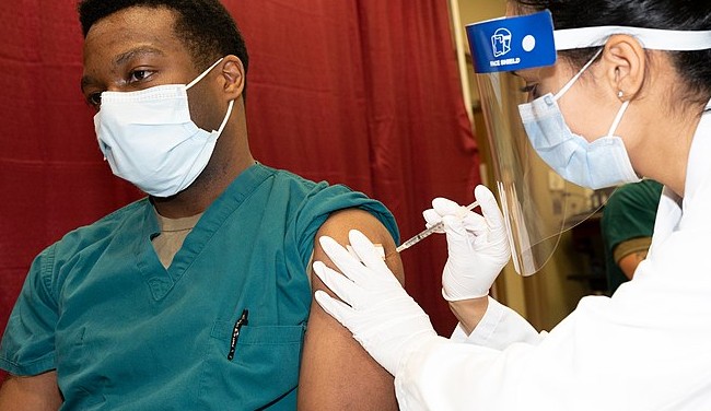 A patient receives a COVID-19 vaccine at a medical facility in Maryland. - WIKIMEDIA COMMONS / U.S. SECRETARY OF DEFENSE