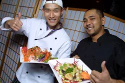 Wasabi owner Isaac Yang and chef Jimmy Kim give their sushi a thumbs up.