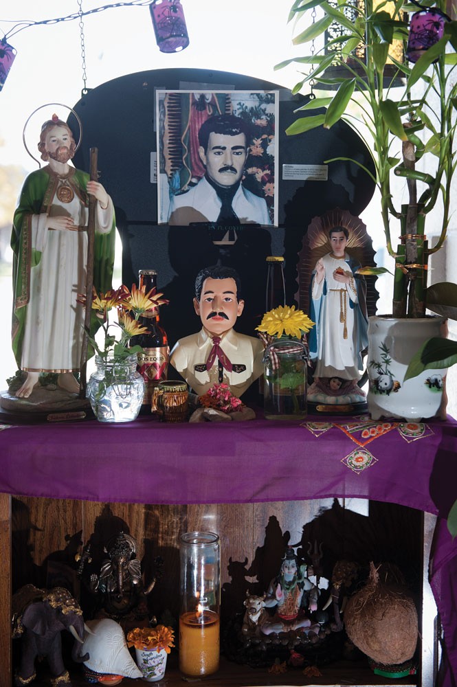 An altar for Jesús Malverde at Botanica San Antonio - NIKI CHAN