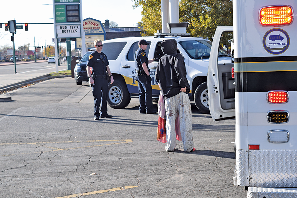 Police respond to a call regarding a homeless woman in the parking lot at 900 West and North Temple, a hotspot for illicit activity - since Operation Rio Grande started more than a year ago. - RAY HOWZE