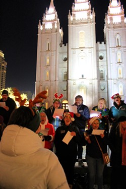 Carolers braved the chilly weather and sang updated renditions of holiday classics like "O Christmas Tree" and "Deck the Halls." - ENRIQUE LIMÓN