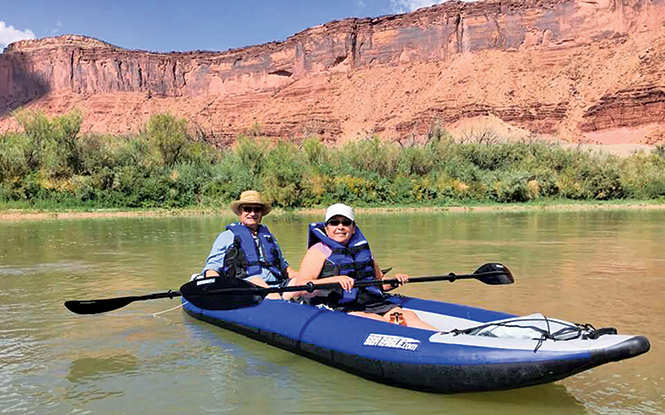 Author Rebecca Chavez-Houck and her husband floating the Colorado River - REBECCA CHAVEZ-HOUCK
