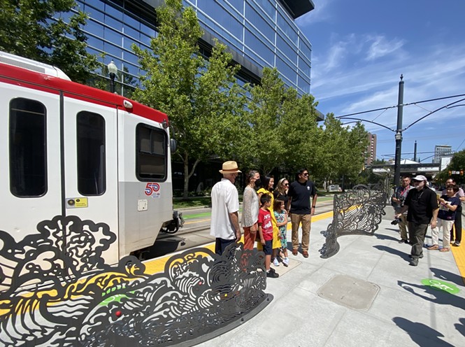 Salt Lake City Mayor Erin Mendenhall poses for photographs with members of the City Council and artist Jiyoun Lee-Lodge and her family at the opening of the 600 South Station on Tuesday, July 26, 2022. - BENJAMIN WOOD