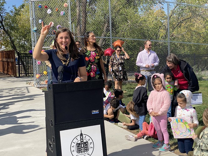 Salt Lake City Mayor Erin Mendenhall gives the "Quiet Coyote" signal to Backman Elementary students on Thursday, Sep. 29, 2022. - BENJAMIN WOOD