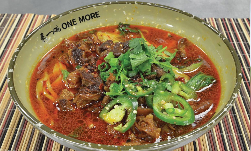 Bowls of spicy broth and noodles at One More Noodle House - COURTESY PHOTO