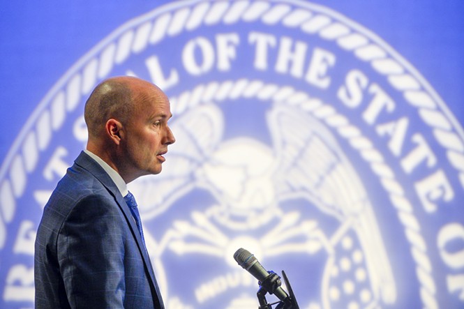 Utah Gov. Spencer Cox stands before a projection of the state seal during a press conference at PBS Utah on Thursday, Feb. 16. - CHRISTOPHER SAMULES | POOL PHOTO