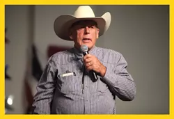 If a peaceful revolution doesn’t work, Dean says, “it will come down to what happened at Bundy’s ranch … but shots being fired.” (Photo of - Cliven Bundy at a July 2014 forum in Mesa, Ariz.)