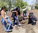 Elementary students and Mayor Mendenhall plant trees at Salt Lake City's new 9-Line Orchard