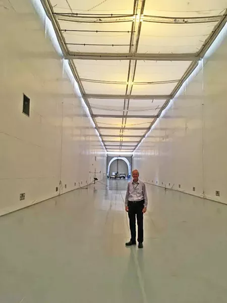 Engineer Branch Chief Gary Millar stands in the Joint Ambient Breeze Tunnel. - DW HARRIS