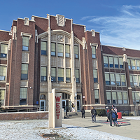 Students arrive at West High School on Monday, Jan. 30. Salt Lake City School District is considering a rebuild of the century-old school.
