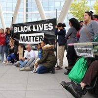 Black Lives Matter supporters rally outside the Public Safety Building on Saturday, Sept. 30 to demand Patrick Harmon body-cam footage be released.
