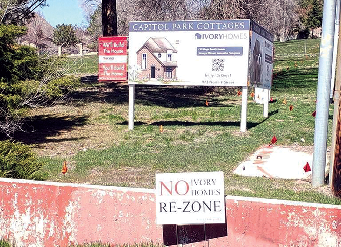 A coming attraction in the Avenues: Capitol Park Cottages (with a protest sign below) - KATHARINE BIELE