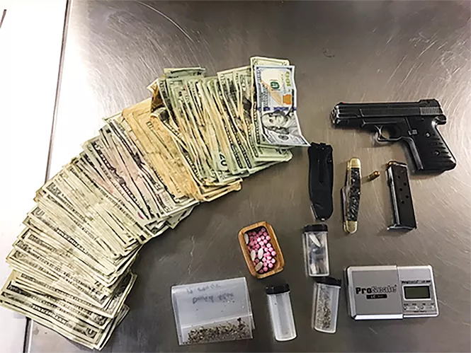 In an early April arrest of a mother and son, cops found cash, spice, pills, digital scales and a handgun. - GREG WILKING