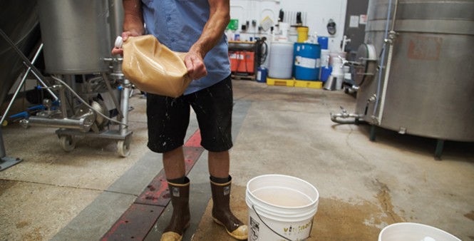 5. Brewer Andrew Rinaldo prepares yeast to be added to the fermentation tank.