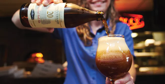 20. The final step: Lerch pours the 20th Anniversary IPA to quench the thirst of a parched patron.