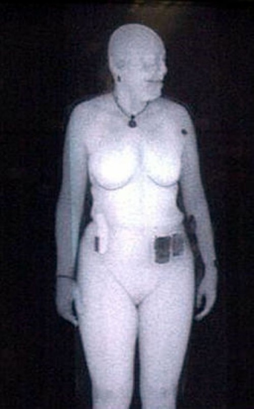 Woman being body scanned - TRANSPORTATION SECURITY ADMINISTRATION