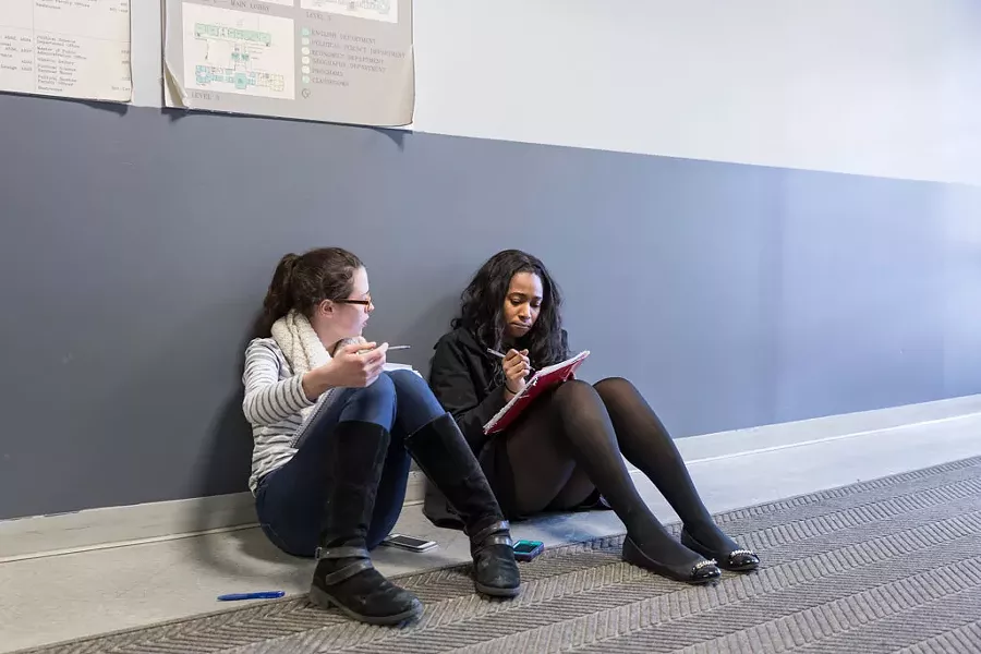 Alexandra Klein (left) and Etinosa Obanor of Cornell University preparing for a debate - OLIVER PARINI