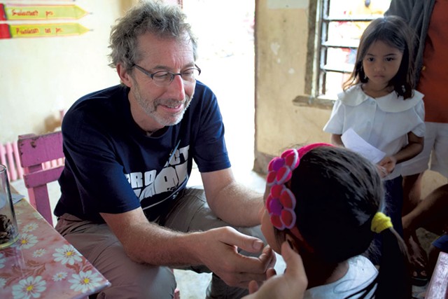 Barry Finette treating children in the Philippines - COURTESY OF BARRY FINETTE