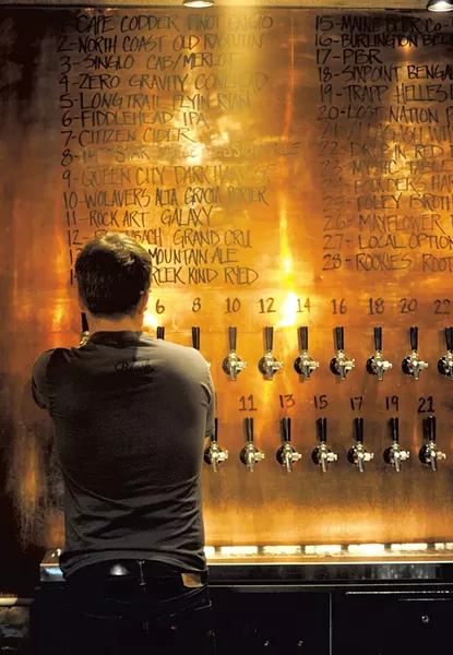 Cullan Calvert pours a draft - JEB WALLACE-BRODEUR