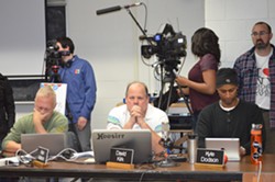 From left, school board members Alan Matson, David Kirk and Kyle Dodson consider a motion at Sunday's emergency meeting. - ALICIA FREESE