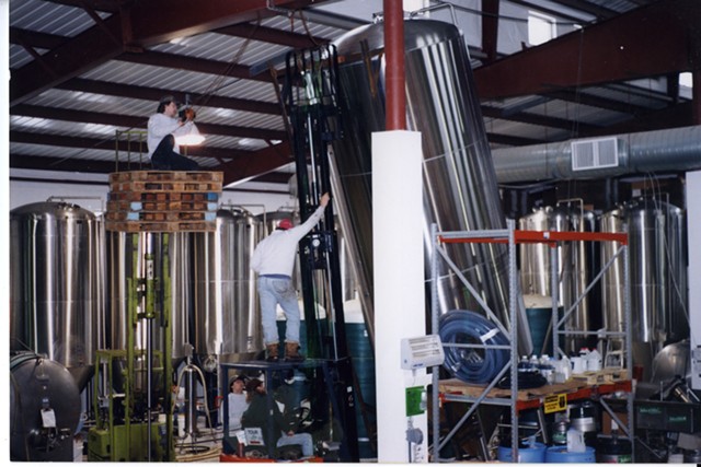 Installing equipment at the new brewery, mid-1990s. - COURTESY OF LONG TRAIL BREWING COMPANY