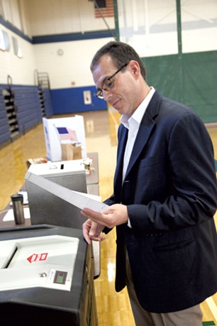 Libertarian gubernatorial candidate Dan Feliciano casts his ballot in Essex on Tuesday. - MATT THORSEN