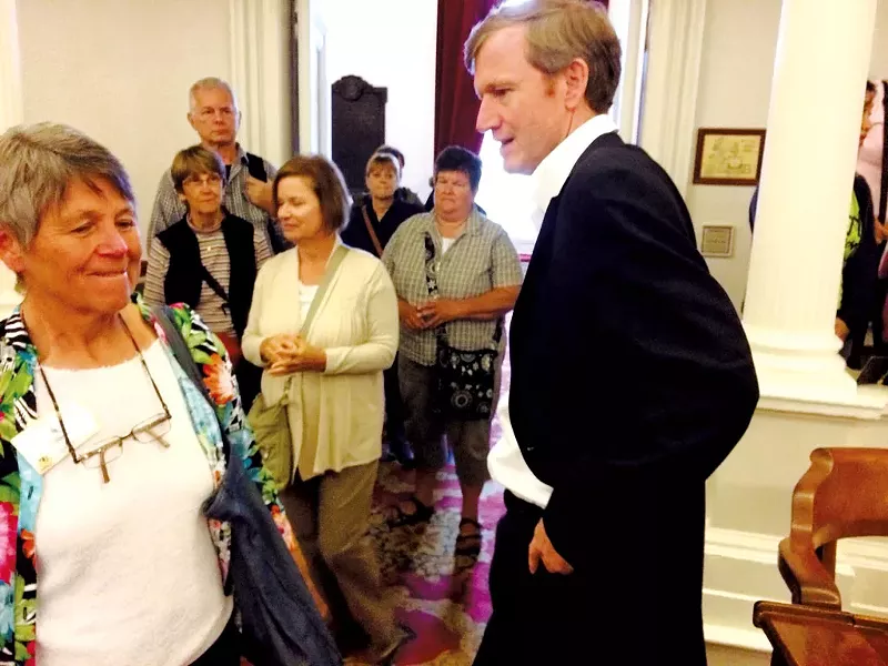 Milne greets an acquaintance on the House floor - MARK DAVIS