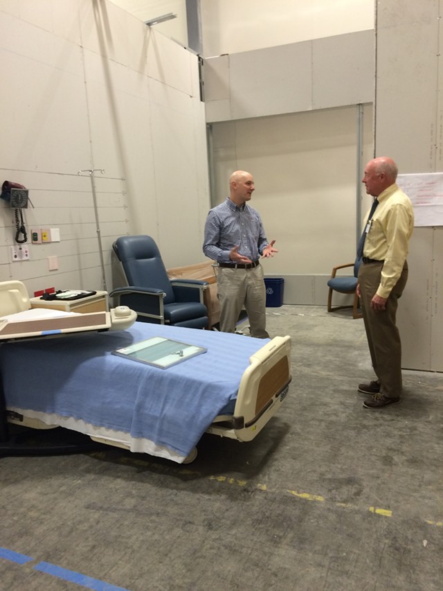 Architect Thomas Morris explains some of the special features in a mock patient room proposed for new medical center tower to Mike Noble, University of Vermont Medical Center media strategist. - NANCY REMSEN