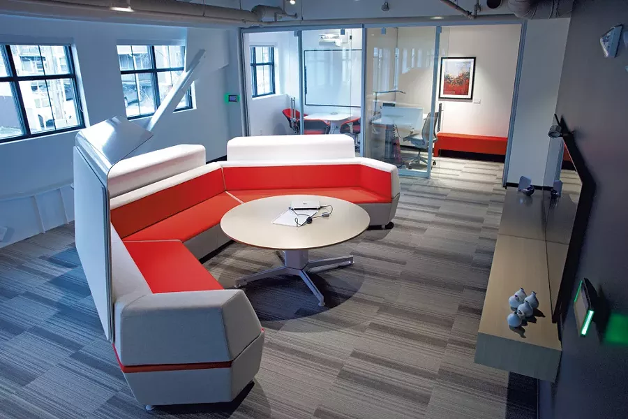 Red Thread's Burlington showroom has couches for lounging and impromptu meetings outside of glassed-in workstations for privacy. - MATTHEW THORSEN