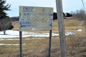 Sign near a closed border crossing - MARK DAVIS