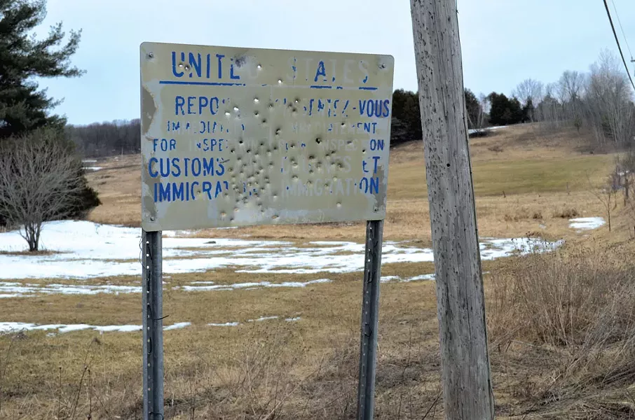 Sign near a closed border crossing - MARK DAVIS