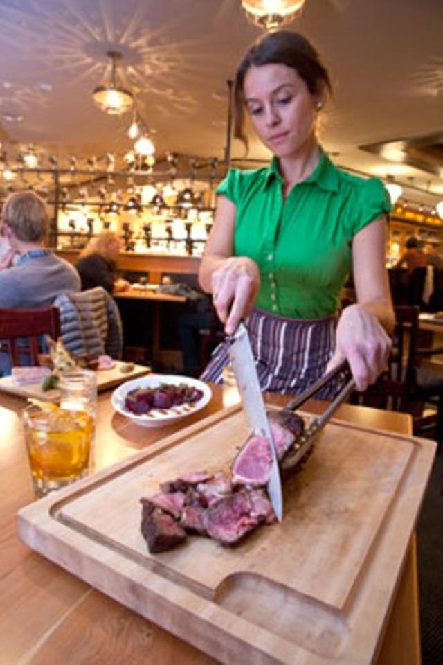 Slicing steak at Guild Tavern - MATTHEW THORSEN
