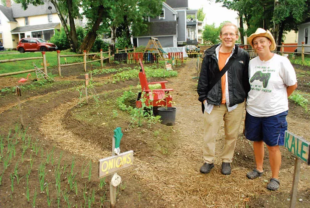 Paul Dreher and Jennifer Bernier at the Summer Street Community Garden. - CORIN HIRSCH