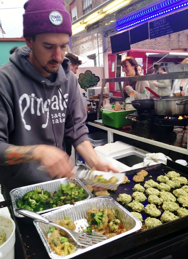 Trevor Sullivan, owner of Pingala Café, making broccoli-potato latkes - STACEY BRANDT