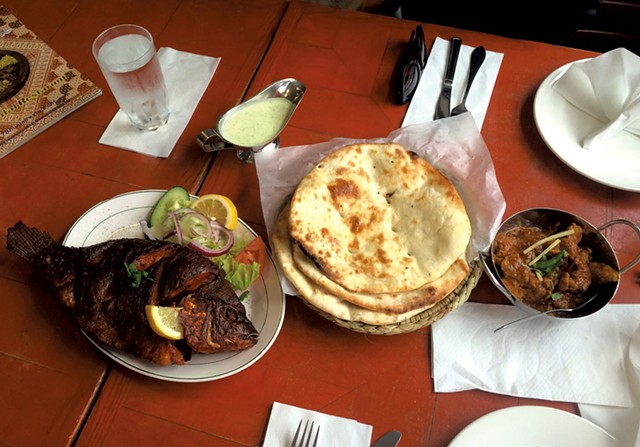 Whole fish, naan and lamb curry at 786 Halal - ALICE LEVITT