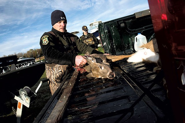Dale Whitlock with a poached deer that will be used as evidence - CALEB KENNA