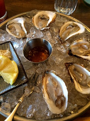 New Year's Day oysters at Misery Loves Co. - SUZANNE M. PODHAIZER