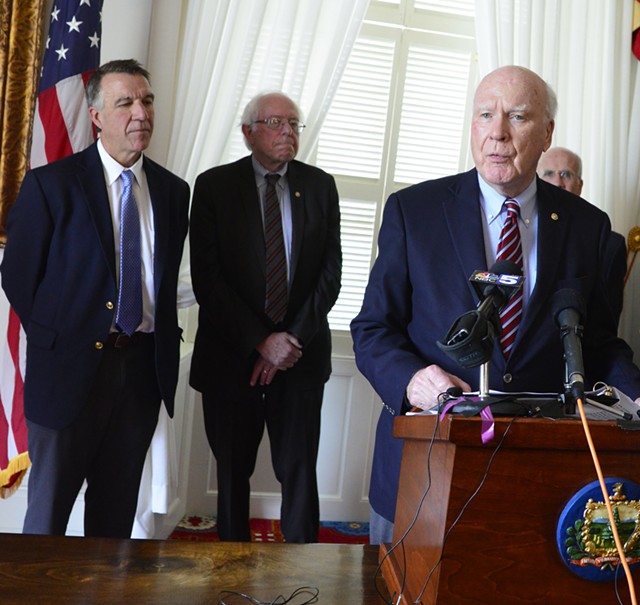 Sen. Patrick Leahy (D-Vt.) speaks at the Vermont Statehouse as Gov. Phil Scott, Sen. Bernie Sanders (I-Vt.) and Congressman Peter Welch (D-Vt.) look on. - FILE: STEFAN HARD