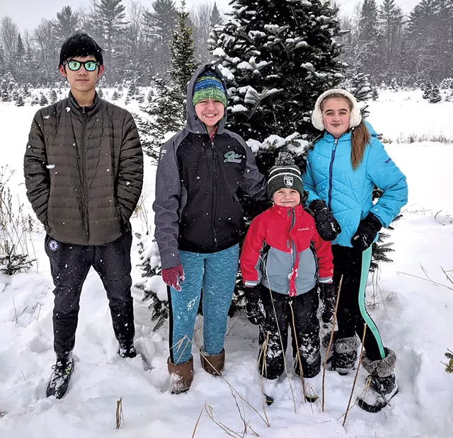 Left to right: Weizhuo "Leo" Kong with the children in his host family, Abbie Fountain, Stewart Lemnah and Madison Fountain - COURTESY OF MELANIE LEMNAH