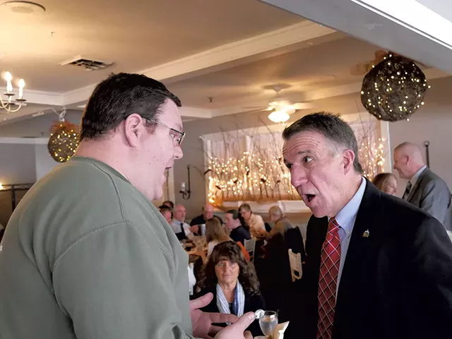 Brien Lemois confronting Gov. Phil Scott at the East Side Restaurant & Pub in Newport - COURTESY OF NEWPORT DISPATCH