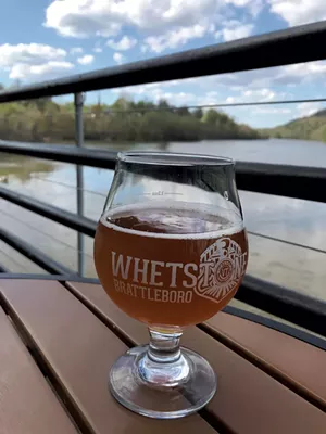 Beer on the patio overlooking the Connecticut River at Whetstone Station in Brattleboro - SALLY POLLAK