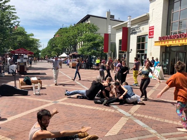 Dancers moving to improvisations by street performer John Holland on Church Street - SADIE WILLIAMS